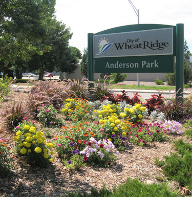 Photo of Anderson Park sign with flowers